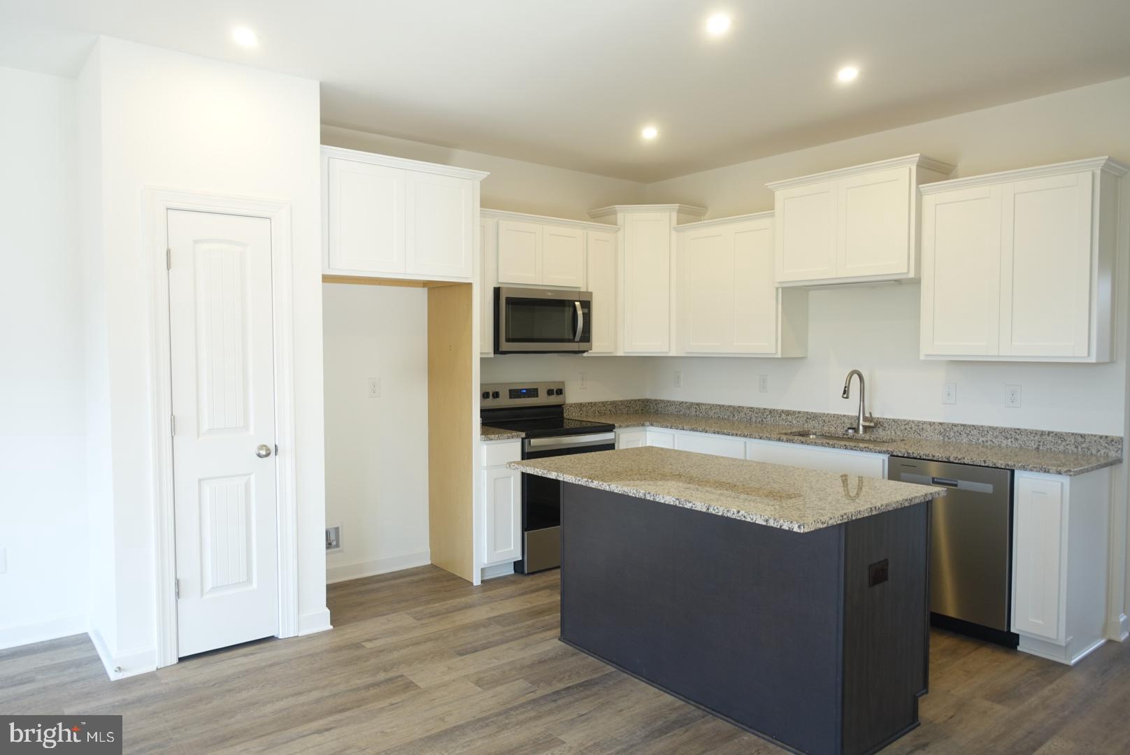 201 Kinneman Road, Unit 25 Abbottstown, PA 17301 - Photo 5 of 32 a kitchen with a sink cabinets and stainless steel appliances