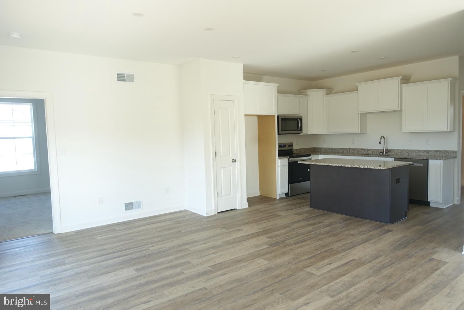 201 Kinneman Road, Unit 25 Abbottstown, PA 17301 - Photo 7 of 32 a view of kitchen with wooden floor