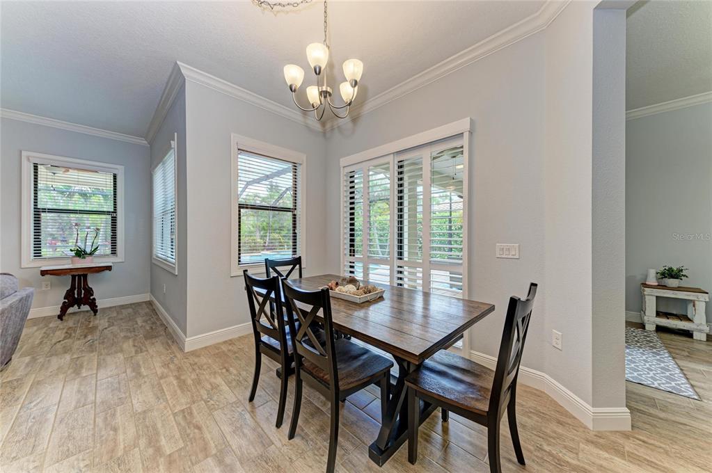 12642 Harney Street Venice, FL 34293 - Photo 18 of 85 a view of a dining room with furniture window and outside view