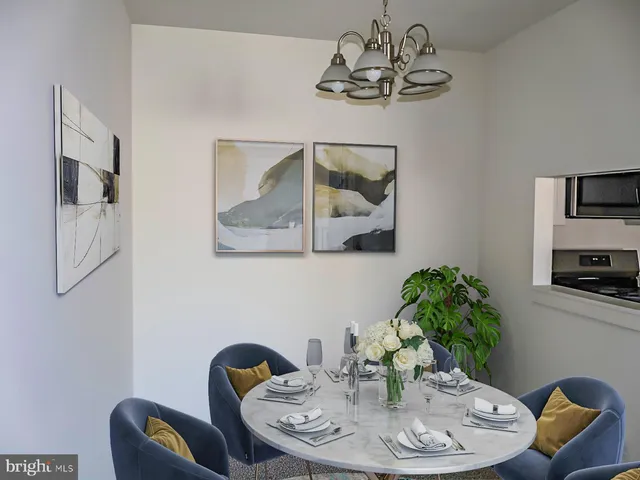 a kitchen with stainless steel appliances granite countertop a refrigerator a stove a sink and a counter