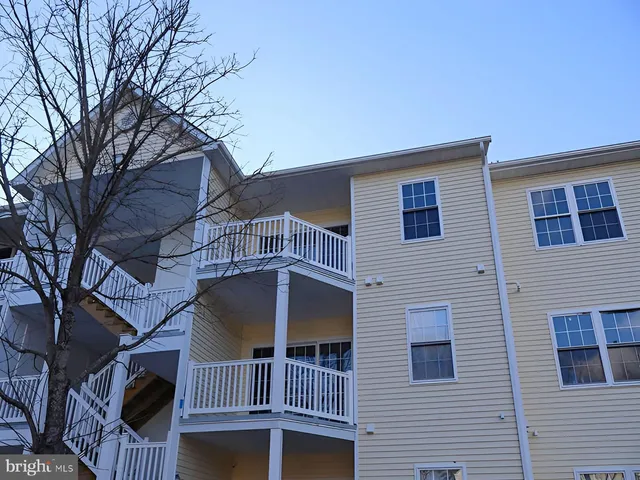outdoor view of a house with iron fence
