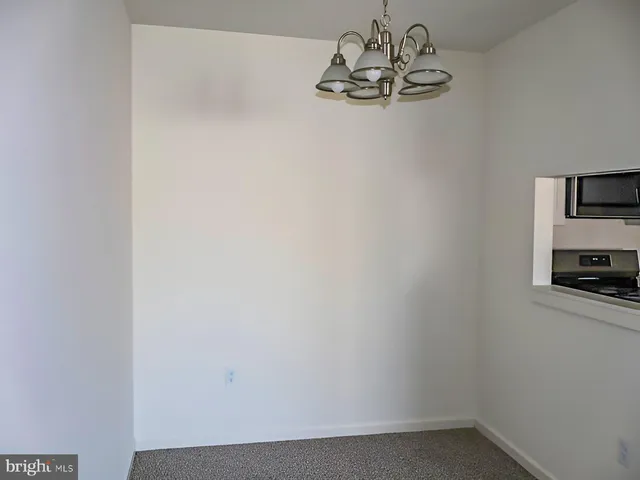 a kitchen with a refrigerator stove and sink