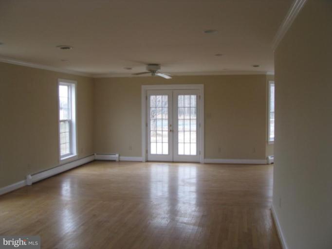 5979 Free State Road Marshall, VA 20115 - Photo 3 of 30 a view of an empty room with glass door and wooden floor