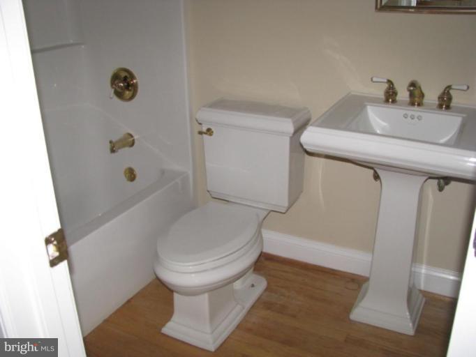 5979 Free State Road Marshall, VA 20115 - Photo 5 of 30 a bathroom with a toilet and a shower