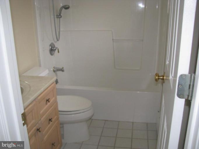 5979 Free State Road Marshall, VA 20115 - Photo 6 of 30 a bathroom with a sink a toilet and shower