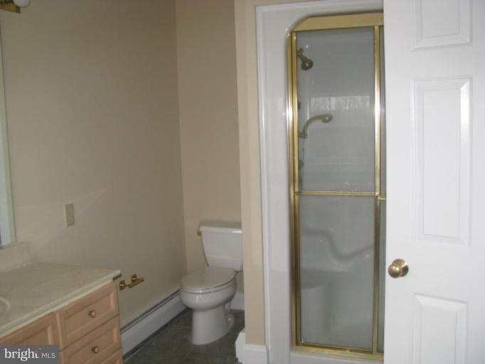 5979 Free State Road Marshall, VA 20115 - Photo 8 of 30 a bathroom with a toilet and a shower