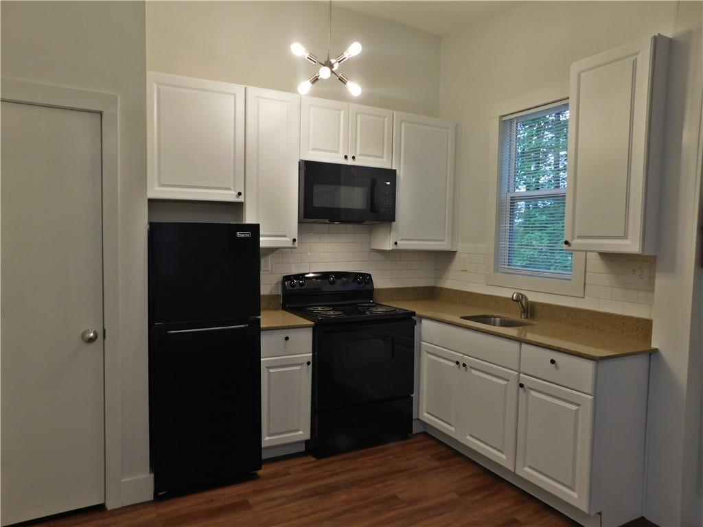 2331 Highway 52 Dahlonega, GA 30533 - Photo 3 of 5 a kitchen with a refrigerator and a stove top oven