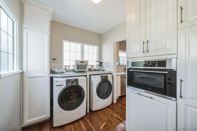 a utility room with sink dryer and washer