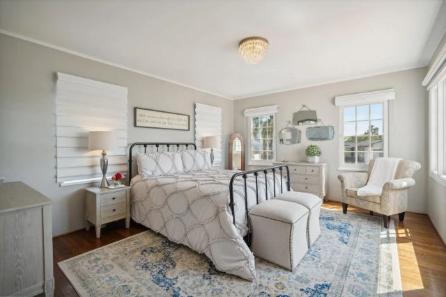 a bedroom with a bed and a couch