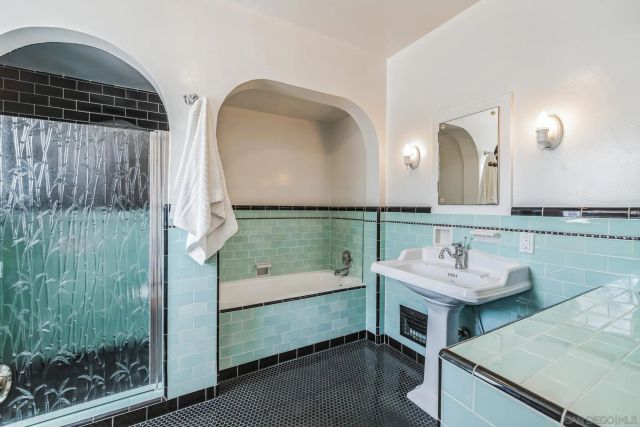a bathroom with a double vanity sink and mirror