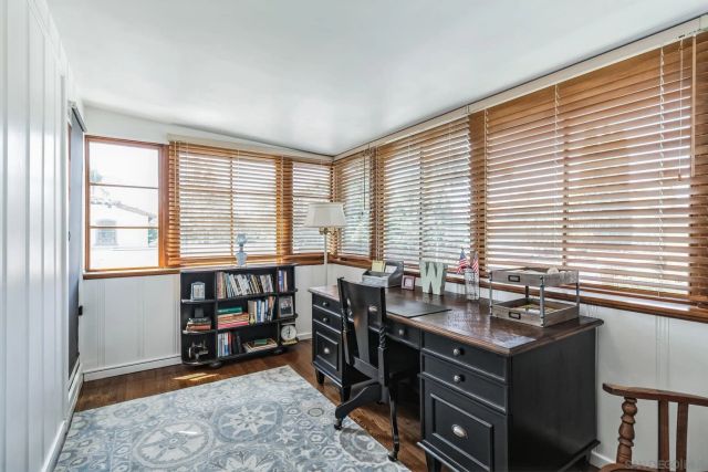 a view of workspace with furniture and window