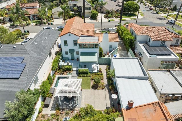 an aerial view of houses with outdoor space