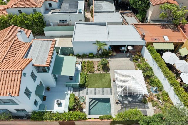 an aerial view of residential houses with outdoor space
