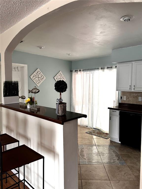 14545 Southwest 34th Terrace Road Ocala, FL 34473 - Photo 10 of 33 Kitchen and dining room leading to backyard