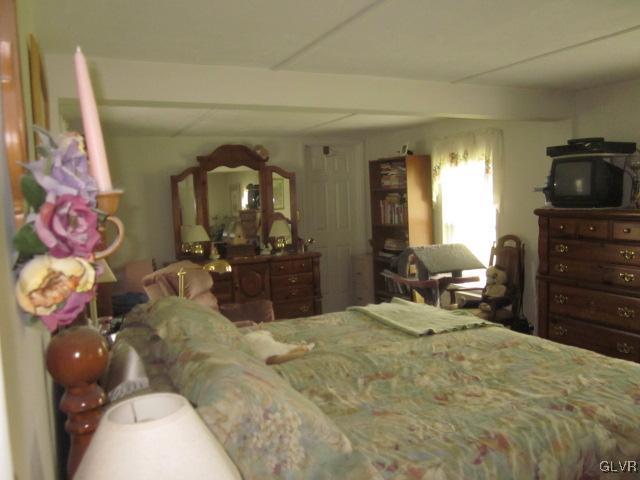 4759 Grammes Road Allentown, PA 18104 - Photo 11 of 14 a bed room with a bed and a television