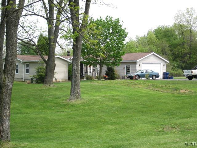 4759 Grammes Road Allentown, PA 18104 - Photo 3 of 14 a front view of house with yard and green space