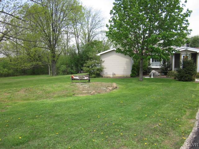 4759 Grammes Road Allentown, PA 18104 - Photo 4 of 14 a house with a tree in front of it