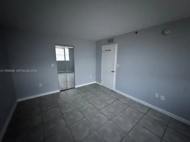 a view of an empty room and window