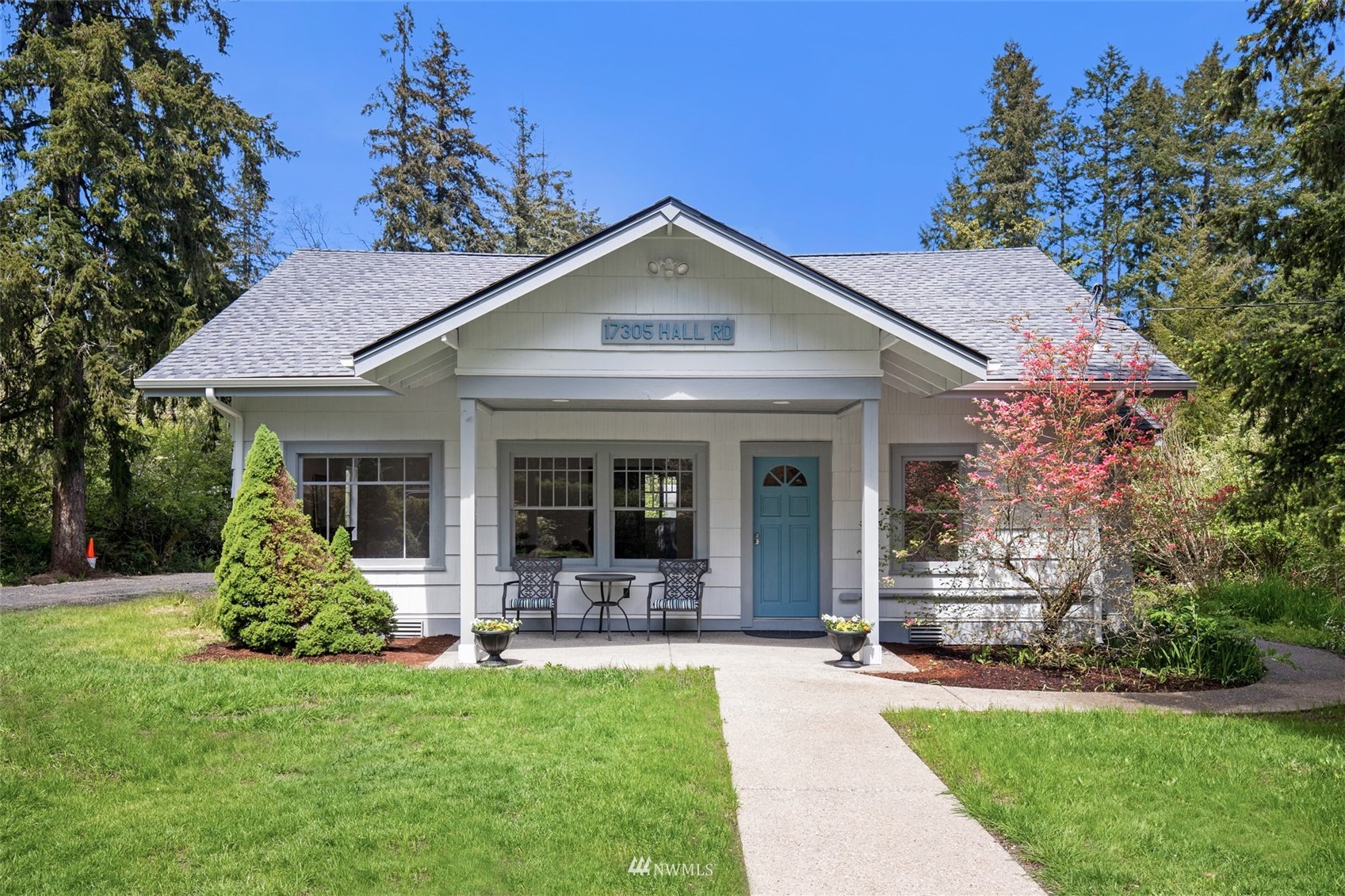 17305 Hall Road Northwest Vaughn, WA 98394 - Photo 1 of 30 a view of a house with yard and garden
