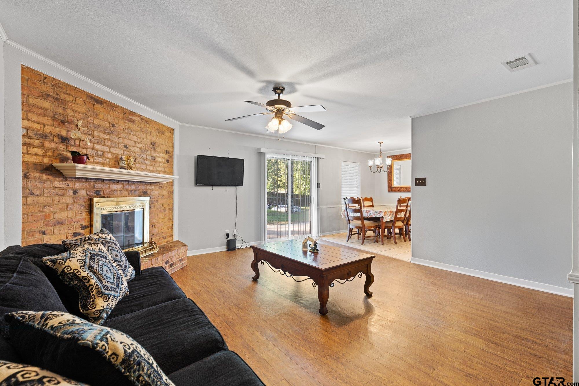 128 Amy Street Longview, TX 75605 - Photo 6 of 21 a living room with furniture and a large window
