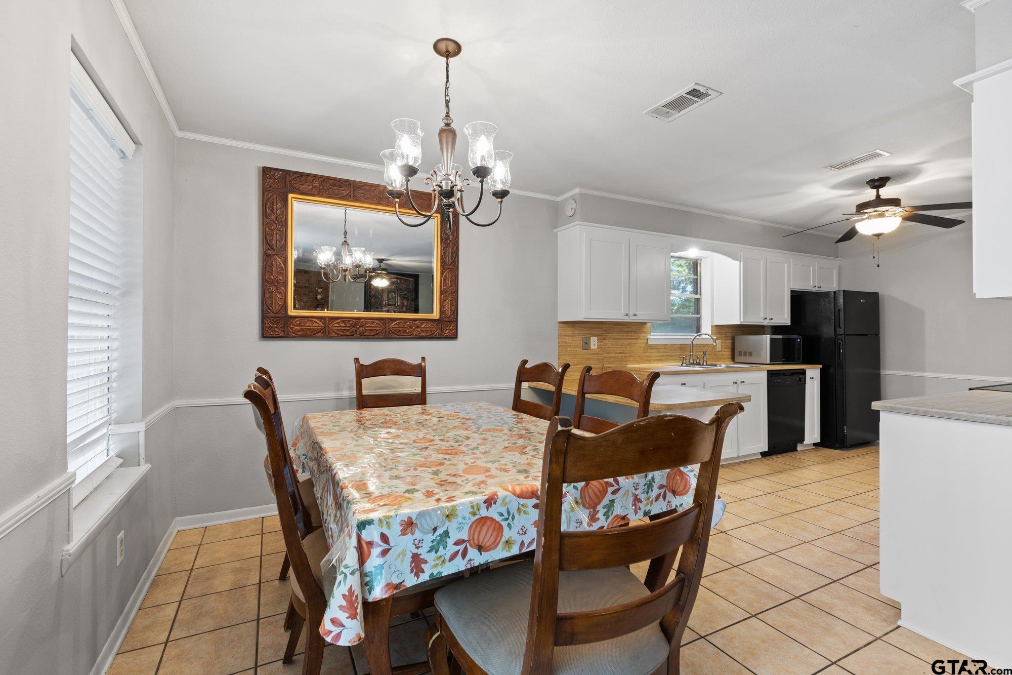128 Amy Street Longview, TX 75605 - Photo 9 of 21 a view of a dining room with furniture