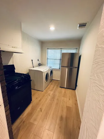 a bed room with a bed and a dresser