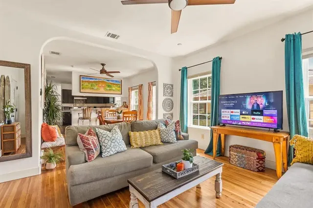 a living room with furniture and a flat screen tv