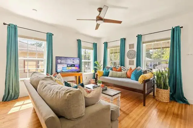 a living room with furniture and a large window