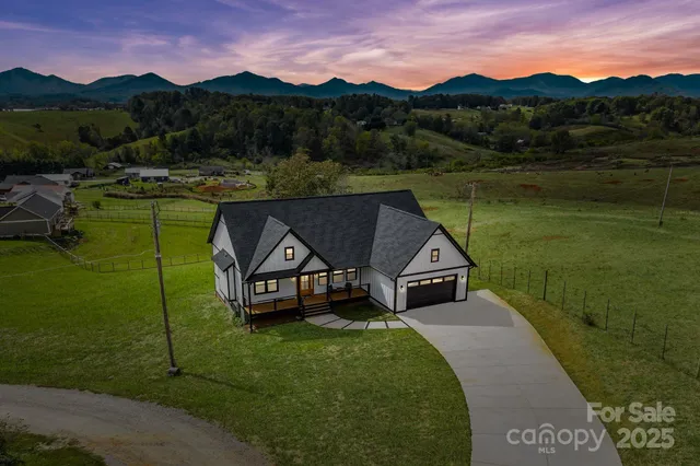 a view of a town with mountains in the background