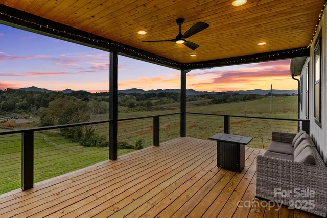 a view of two chairs in the balcony