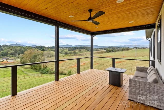 a view of balcony with couch and wooden floor