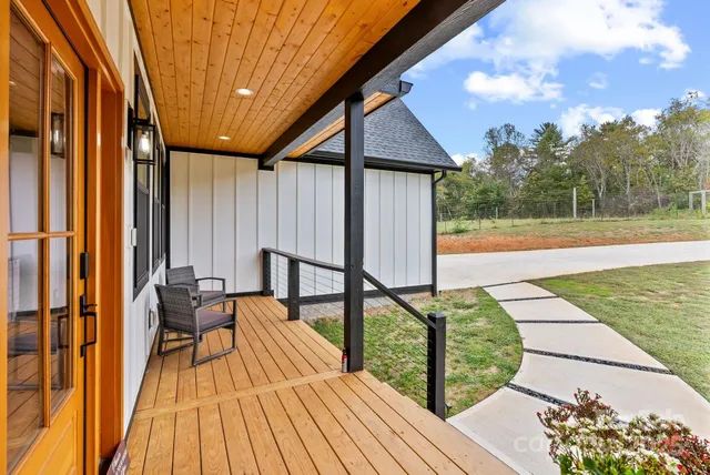 a balcony with chairs and with table