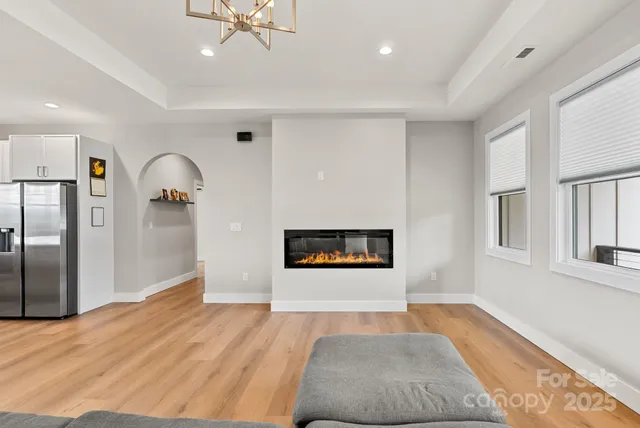 a living room with a couch and a fireplace