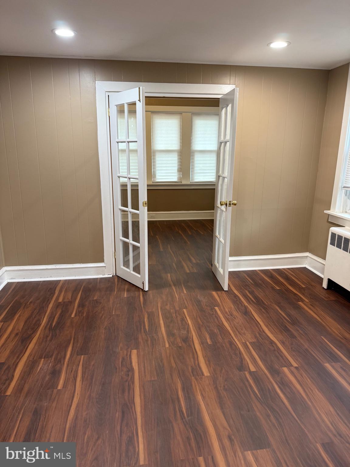 1482 Glassboro Road, Unit A Wenonah, NJ 08090 - Photo 5 of 12 a view of an empty room with wooden floor and a window