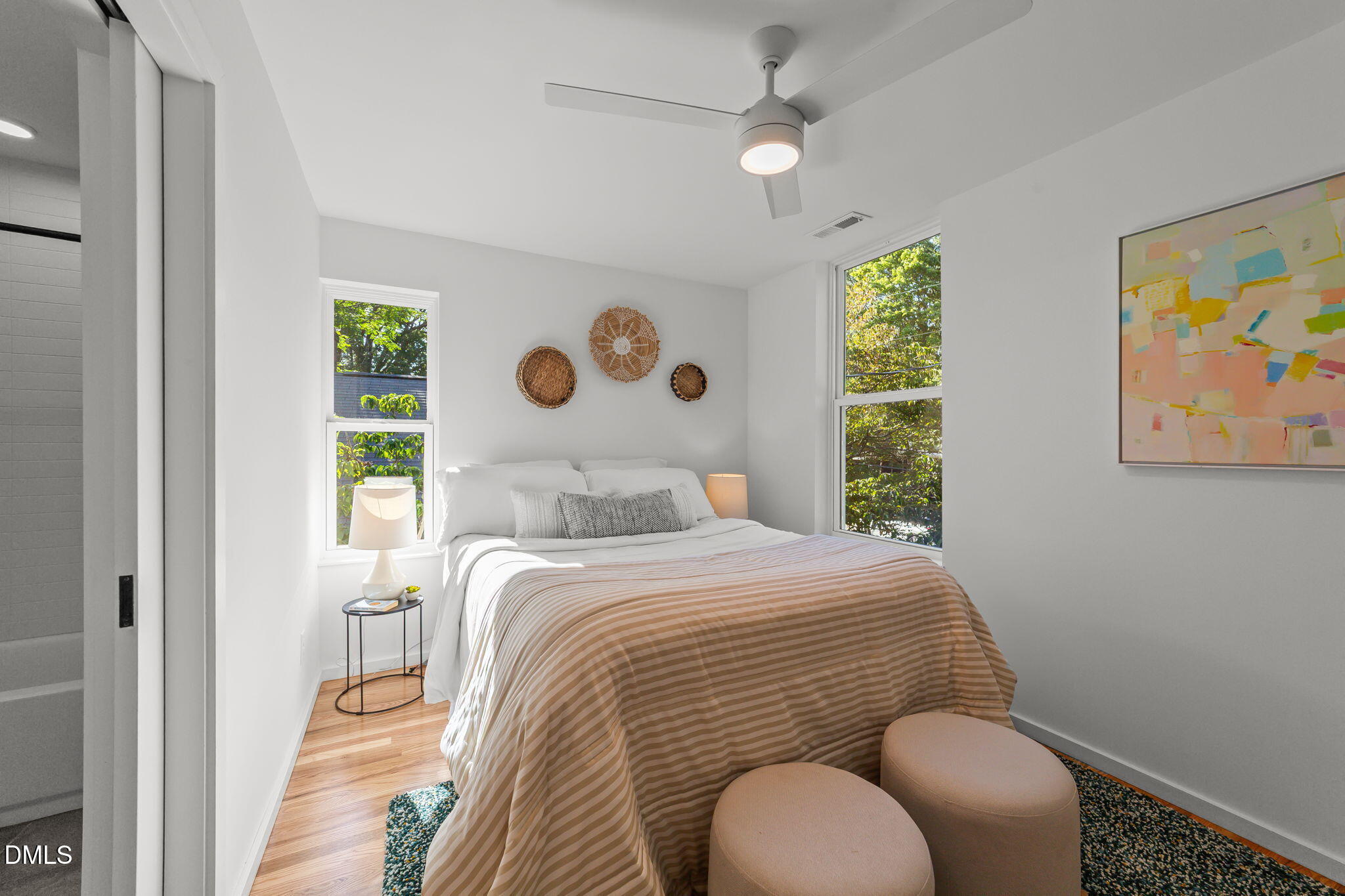 301 Clark Street Durham, NC 27701 - Photo 18 of 30 a bedroom with a bed and a painting on the wall