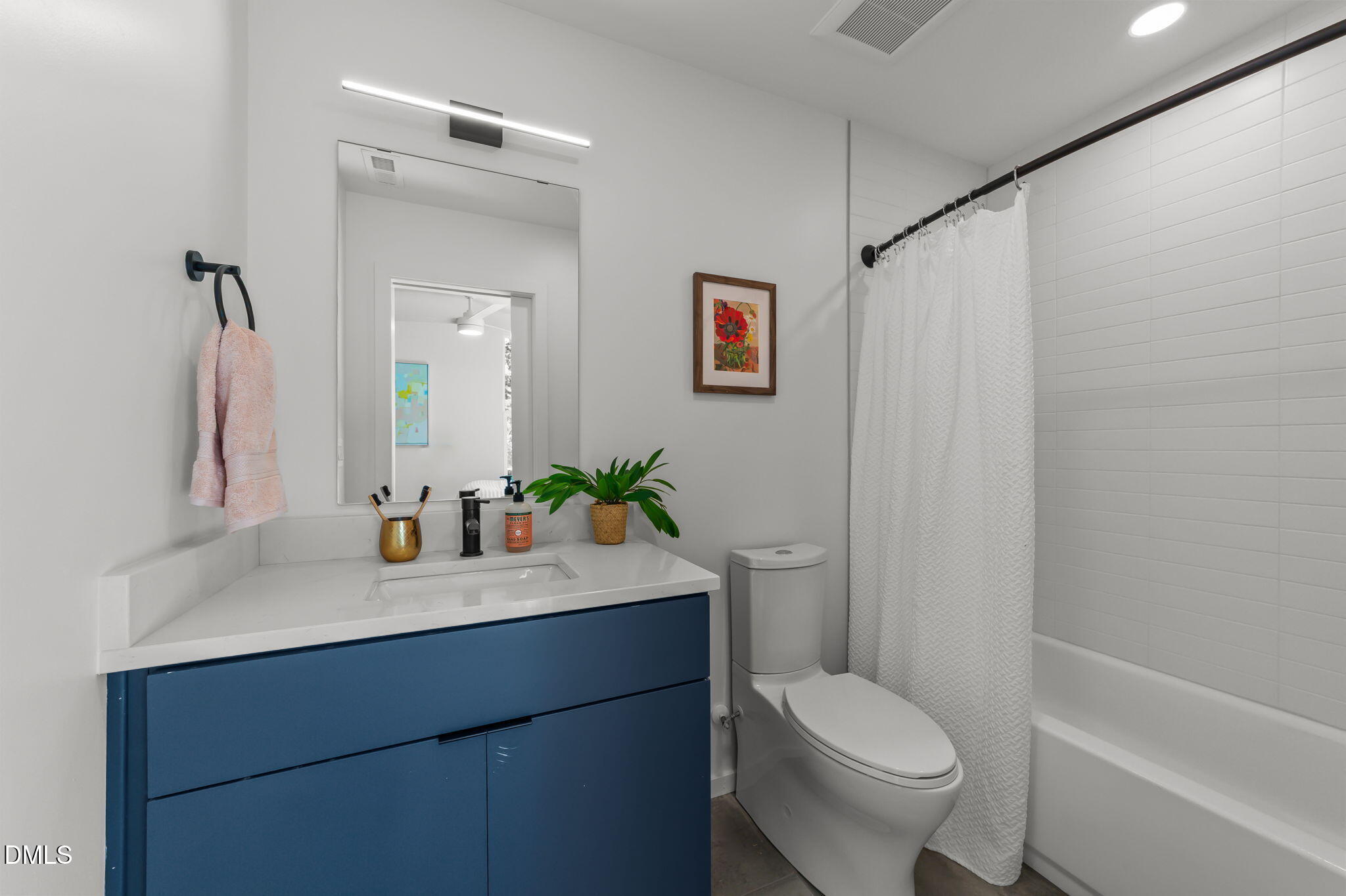 301 Clark Street Durham, NC 27701 - Photo 20 of 30 a bathroom with a sink vanity mirror and toilet