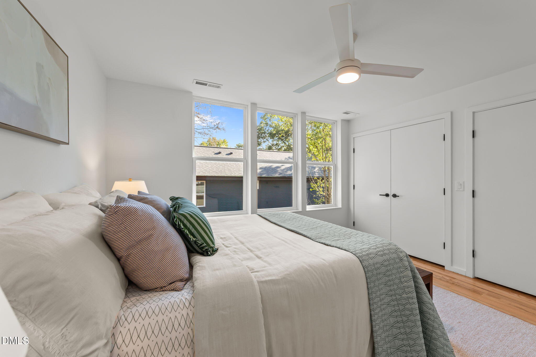 301 Clark Street Durham, NC 27701 - Photo 23 of 30 a bedroom with a bed and a large window
