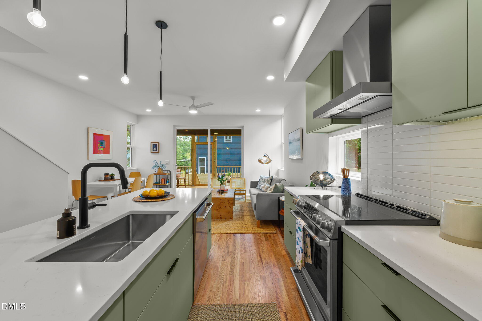 301 Clark Street Durham, NC 27701 - Photo 6 of 30 a kitchen filled a sink a counter space appliances and cabinets