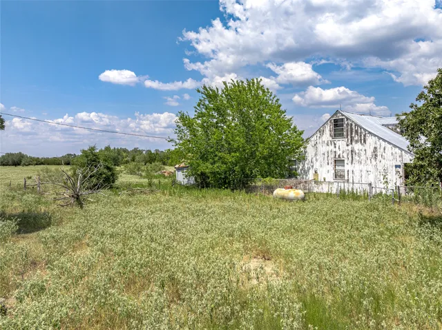 a view of backyard with green space