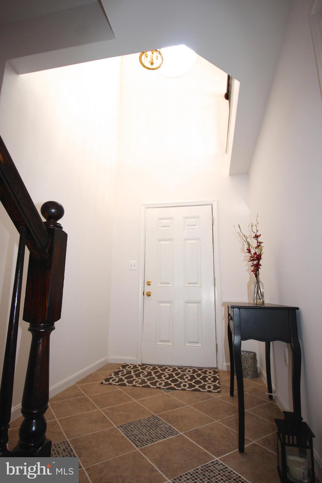 10556 Falkirk Way Manassas, VA 20109 - Photo 2 of 23 a view of an entryway with wooden floor