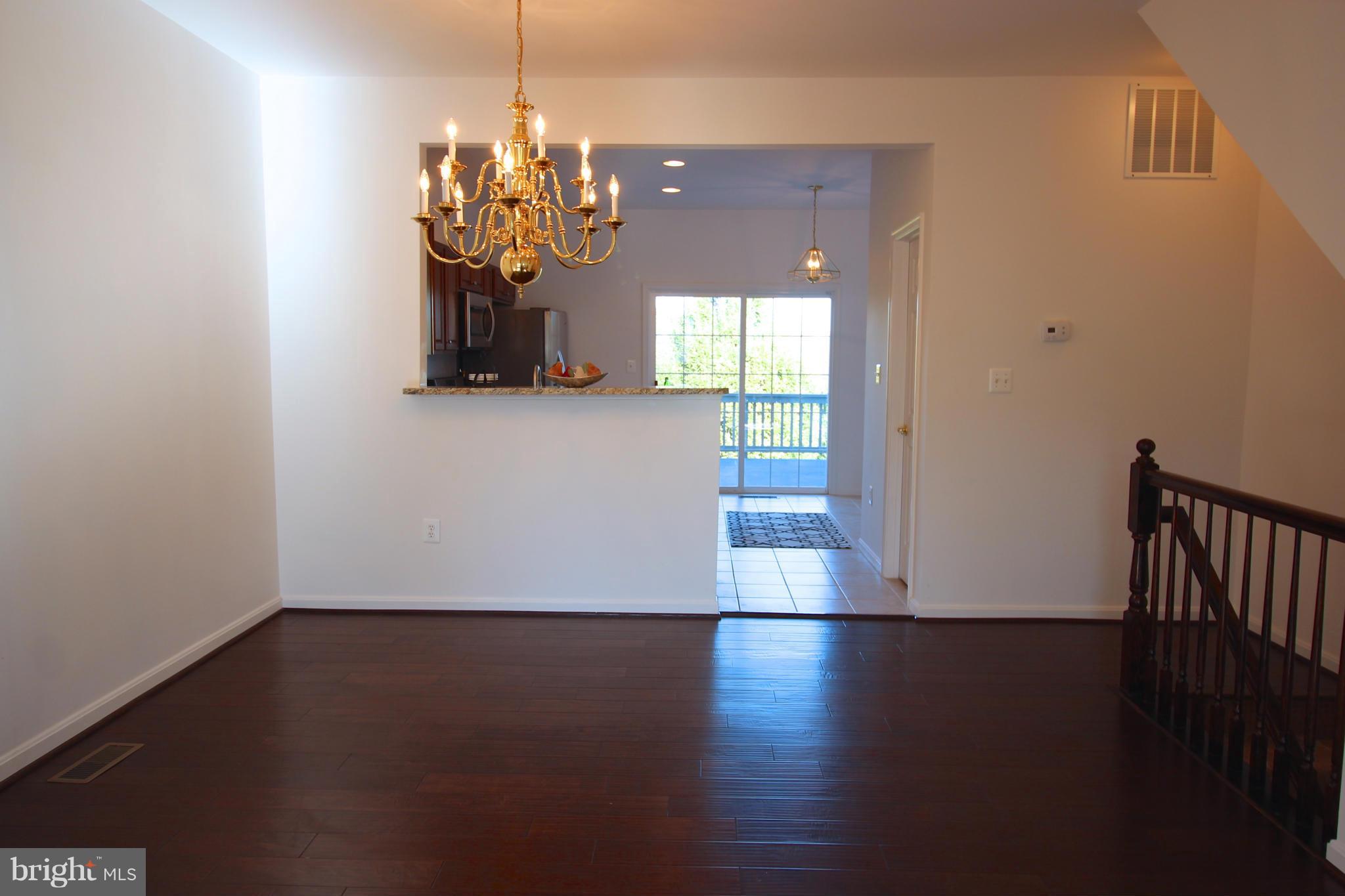 10556 Falkirk Way Manassas, VA 20109 - Photo 11 of 23 a view of a room with wooden floor and a window