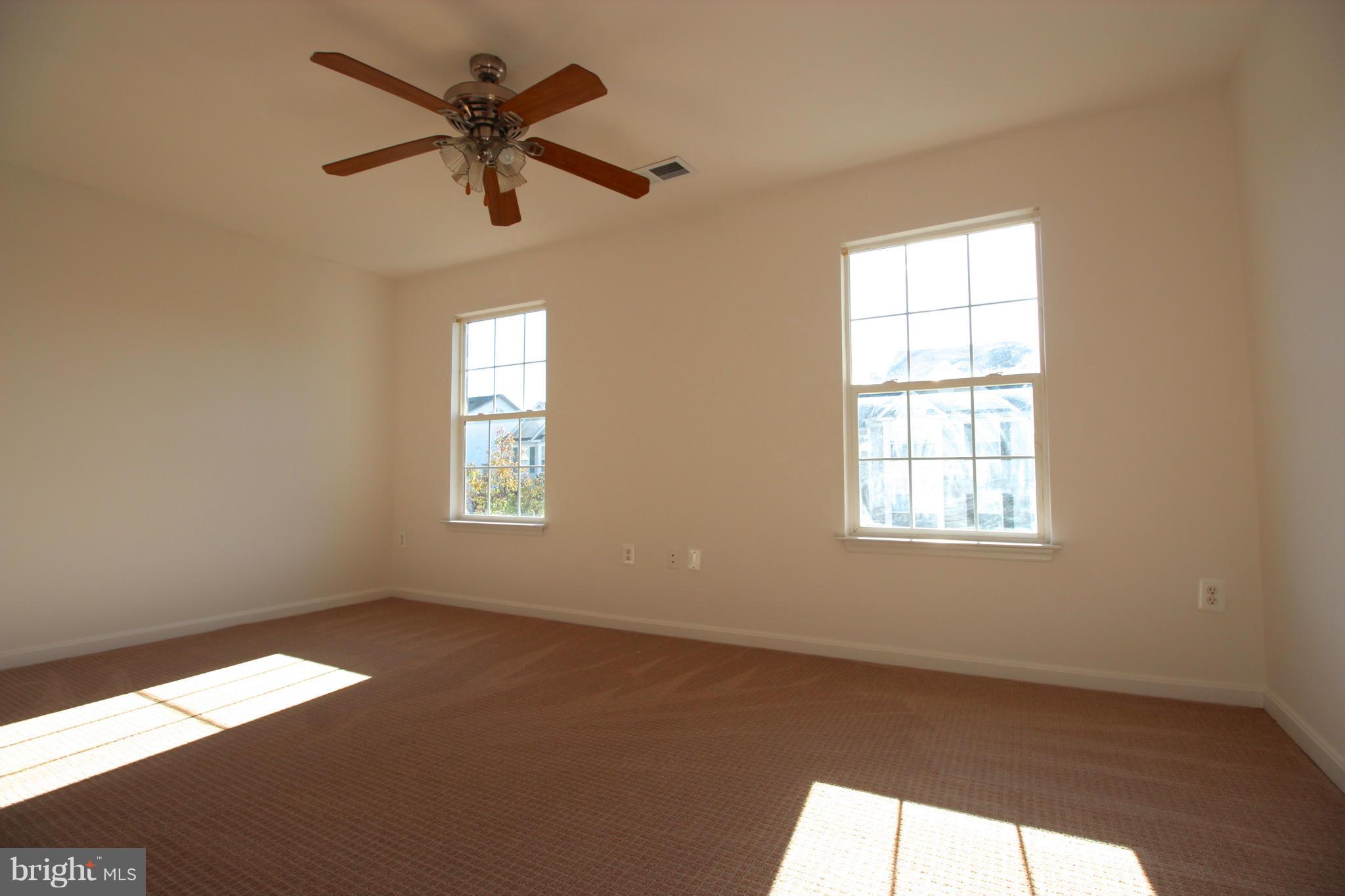 10556 Falkirk Way Manassas, VA 20109 - Photo 12 of 23 an empty room with fan and windows