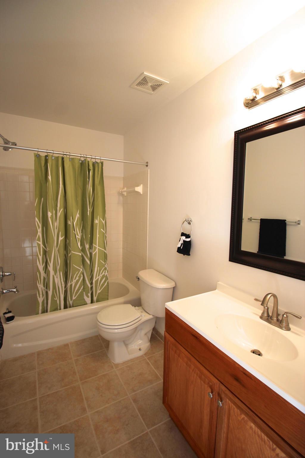 10556 Falkirk Way Manassas, VA 20109 - Photo 15 of 23 a bathroom with a sink a toilet and shower