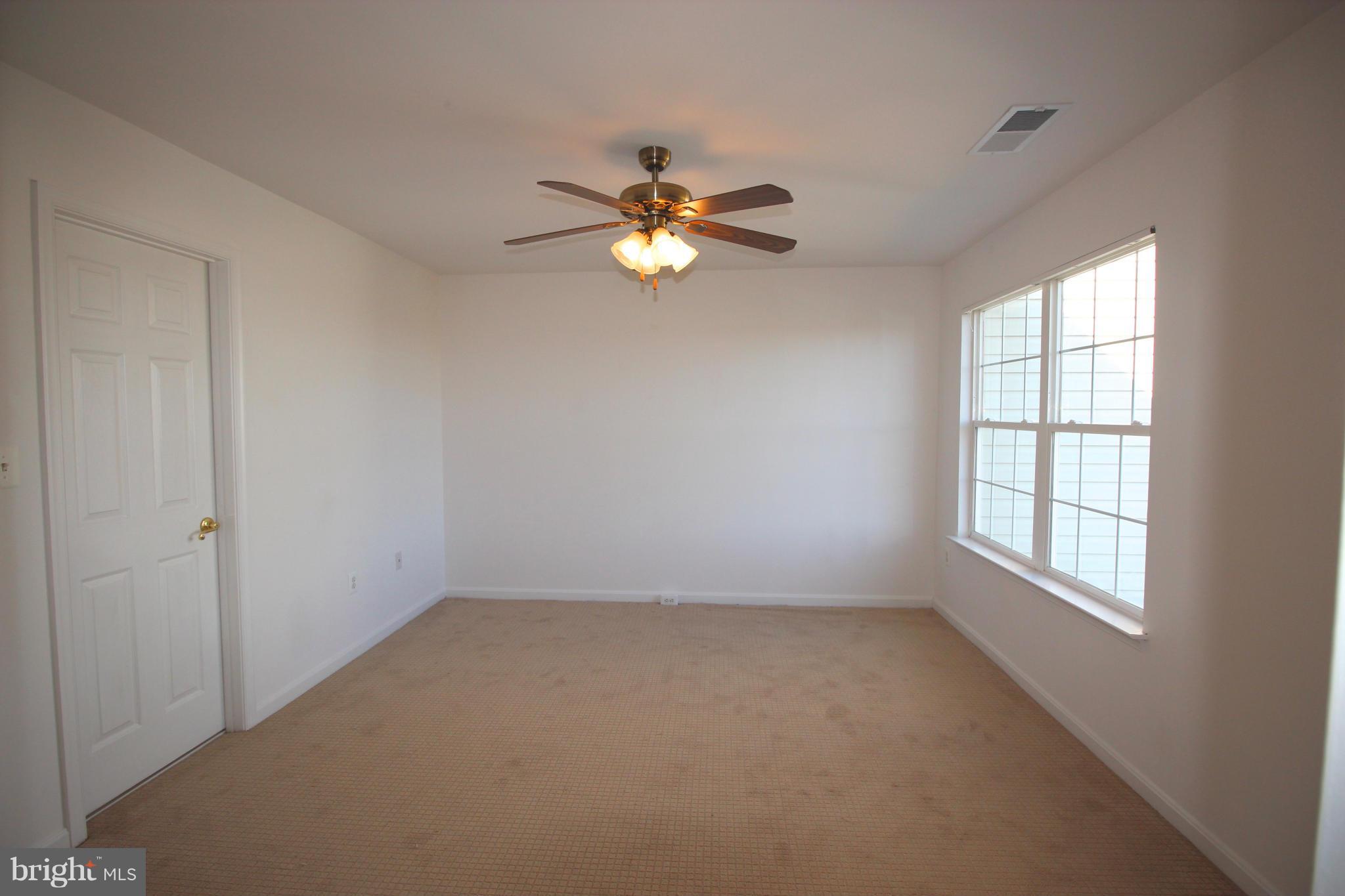 10556 Falkirk Way Manassas, VA 20109 - Photo 16 of 23 wooden floor in an empty room with a window