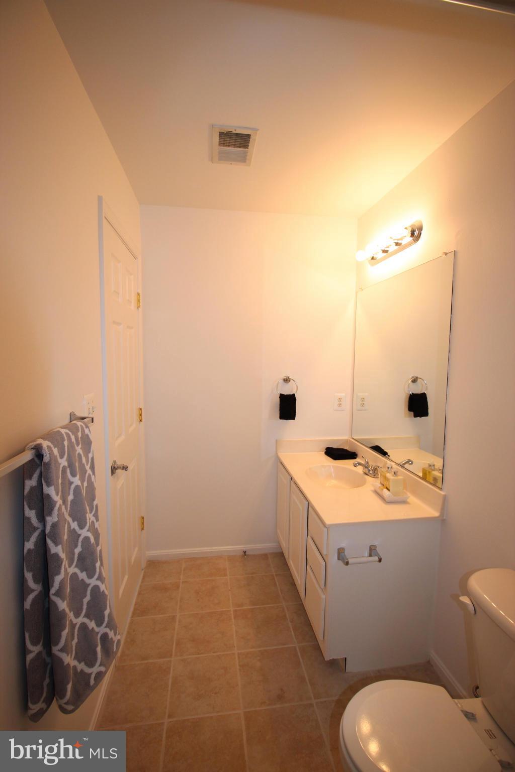 10556 Falkirk Way Manassas, VA 20109 - Photo 17 of 23 a bathroom with a sink and a mirror