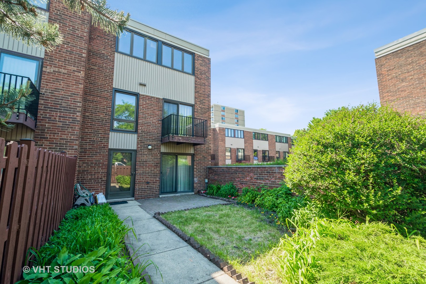 900 South Laflin Street Chicago, IL 60607 - Photo 18 of 20 a view of a brick house with a yard and plants