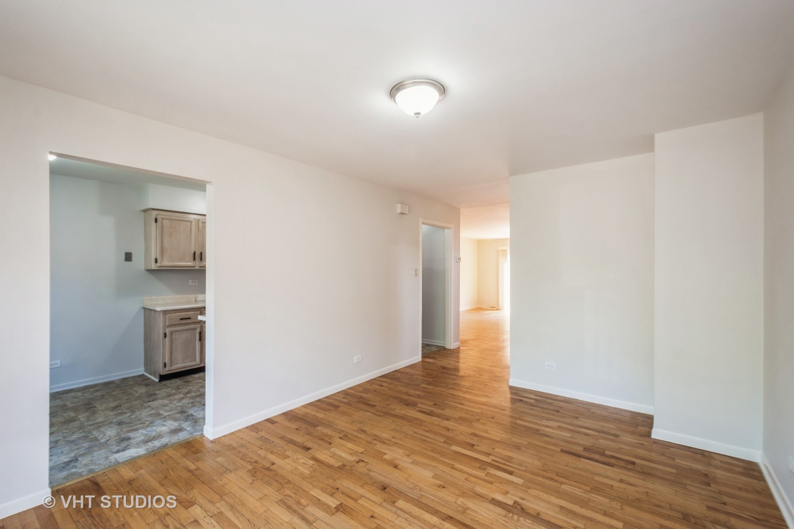 900 South Laflin Street Chicago, IL 60607 - Photo 7 of 20 a view of a kitchen with a sink and a refrigerator