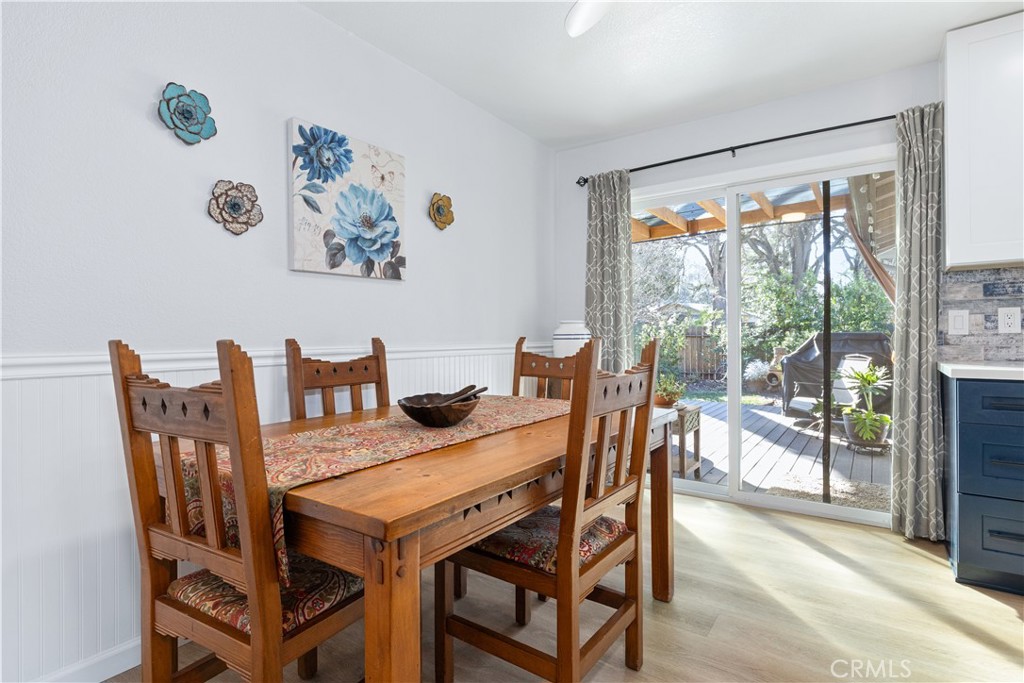 8425 Azucena Avenue Atascadero, CA 93422 - Photo 12 of 47 a view of a dining room with furniture large windows and a chandelier