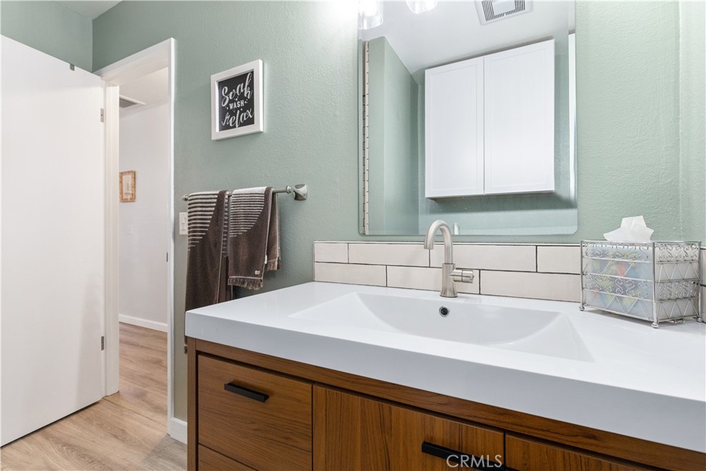 8425 Azucena Avenue Atascadero, CA 93422 - Photo 20 of 47 a bathroom with a sink and a mirror