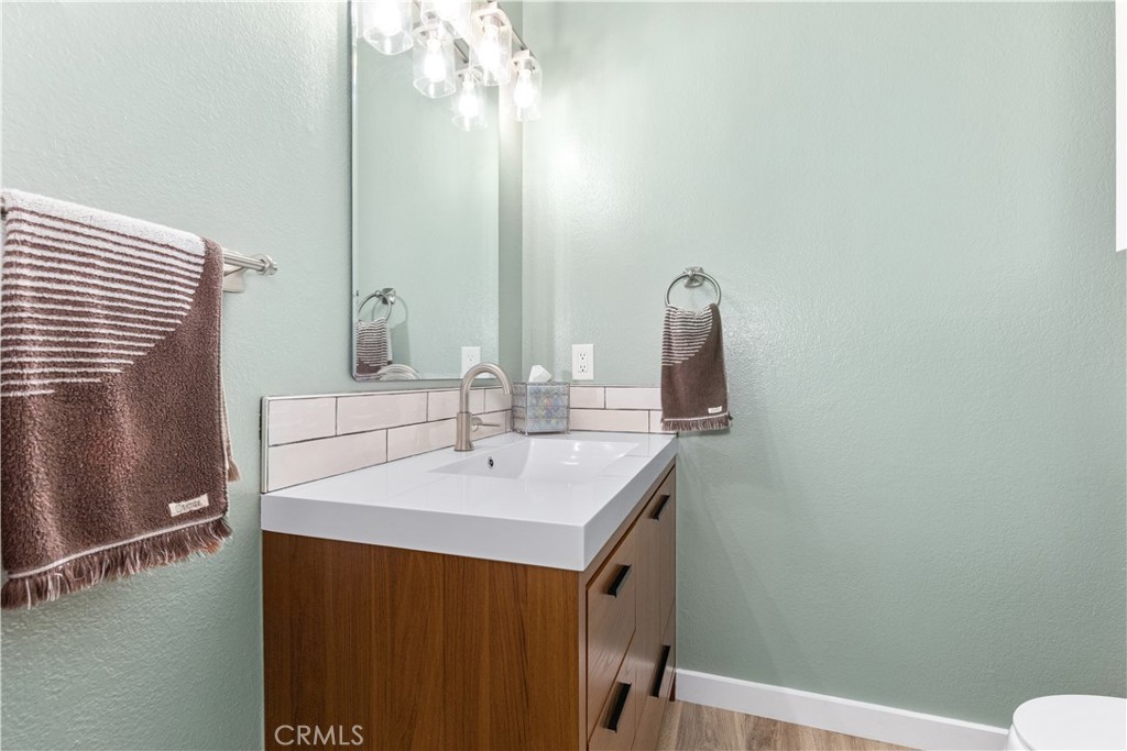 8425 Azucena Avenue Atascadero, CA 93422 - Photo 21 of 47 a bathroom with a sink and a mirror